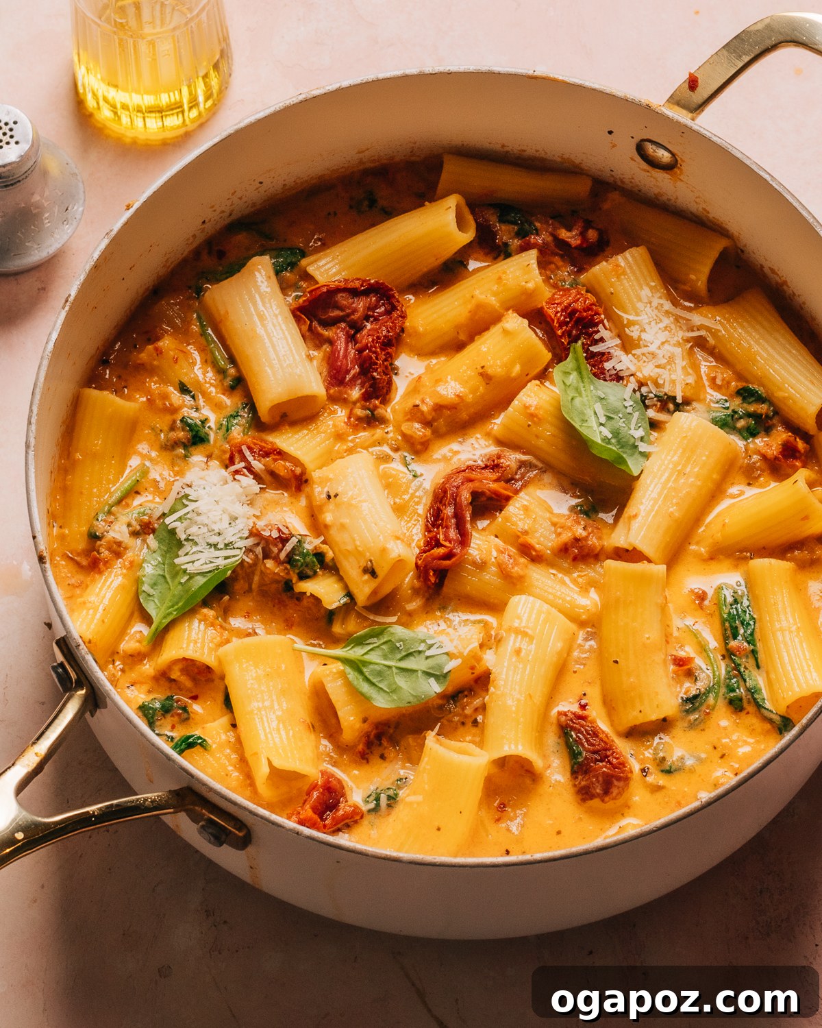 14+ Effortless Valentine's Day Family Feasts 6 Hearty Tuscan chicken pasta simmering in a pot, rich with sauce and ingredients.