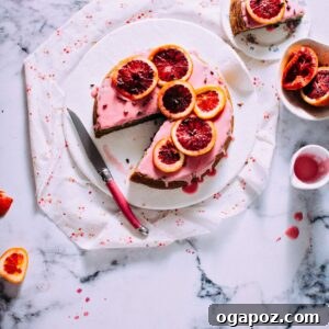 Blood Orange Cake topped with slices of blood orange and glaze.