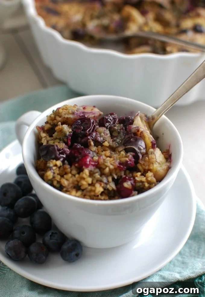 Baked Blueberry Banana Steel Cut Oat Bake 2 A beautifully presented dish of Baked Blueberry Banana Steel Cut Oatmeal, topped with fresh blueberries and banana slices, ready for a healthy breakfast.