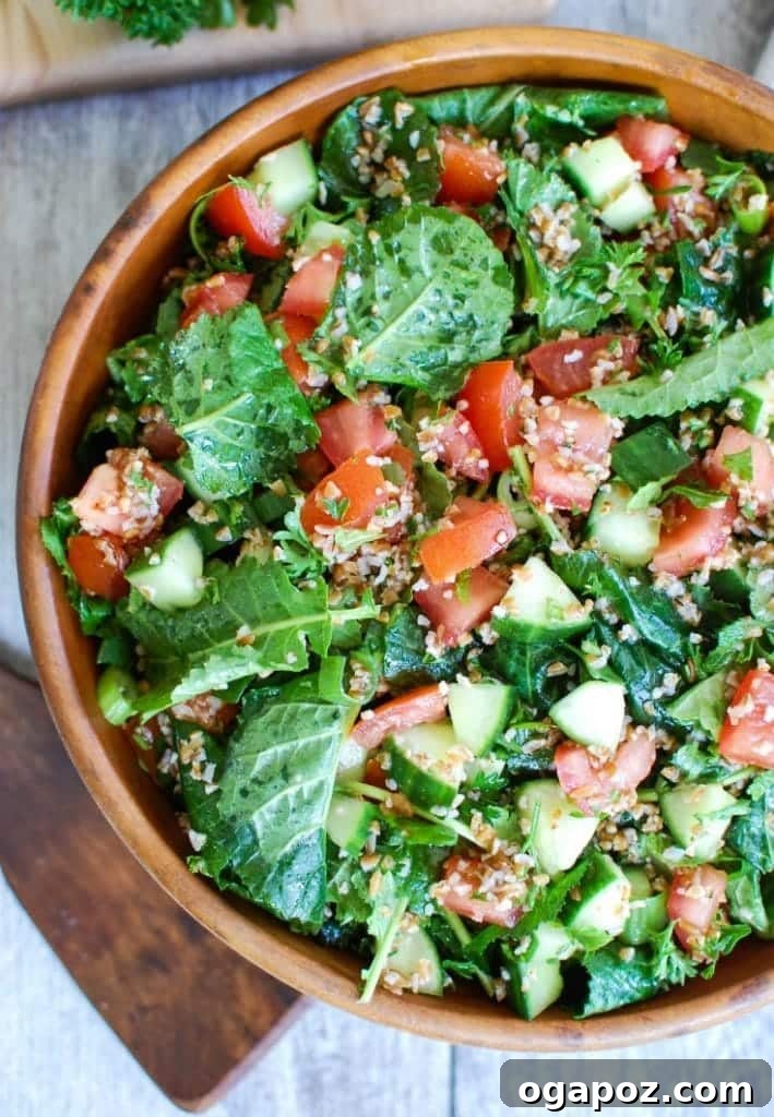 Vibrant Kale Cucumber Tabbouleh 2 Vibrant Kale Cucumber Tabbouleh in a rustic wooden bowl, showcasing its fresh ingredients and inviting colors