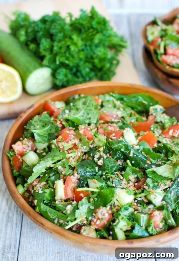 Vibrant Kale Cucumber Tabbouleh 5 Generous serving of Kale Cucumber Tabbouleh with ripe tomatoes visible, highlighting its freshness and bright colors