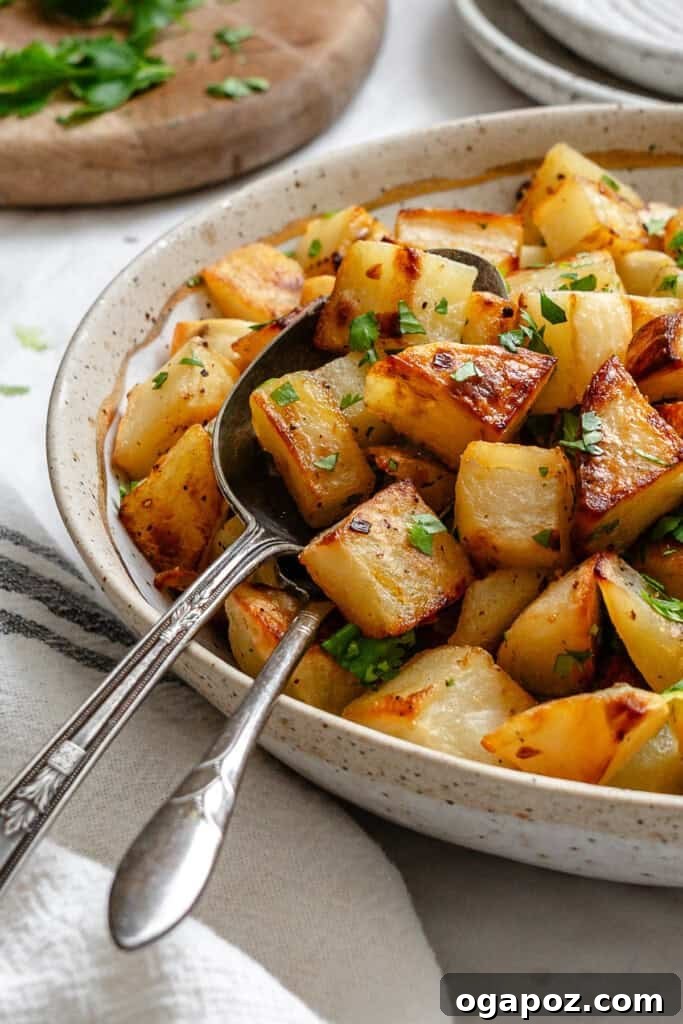 Bright Lemon & Cilantro Roasted Potatoes 2 Lemon Cilantro Roasted Potatoes in a white bowl, garnished with fresh cilantro