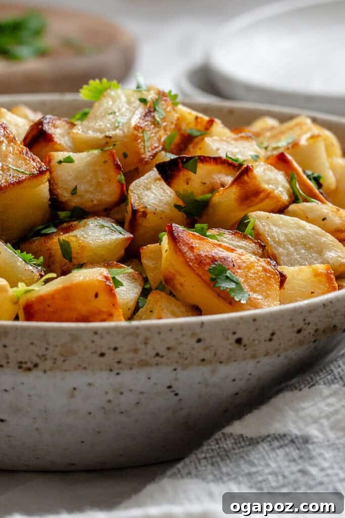 Bright Lemon & Cilantro Roasted Potatoes 5 Lemon Cilantro Roasted Potatoes on a baking sheet with cilantro garnish