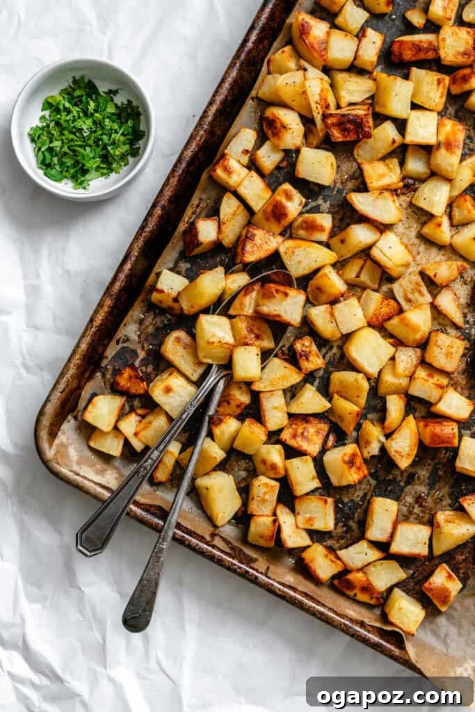 Bright Lemon & Cilantro Roasted Potatoes 8 Freshly roasted Lemon Cilantro Roasted Potatoes on a baking sheet, topped with fresh cilantro