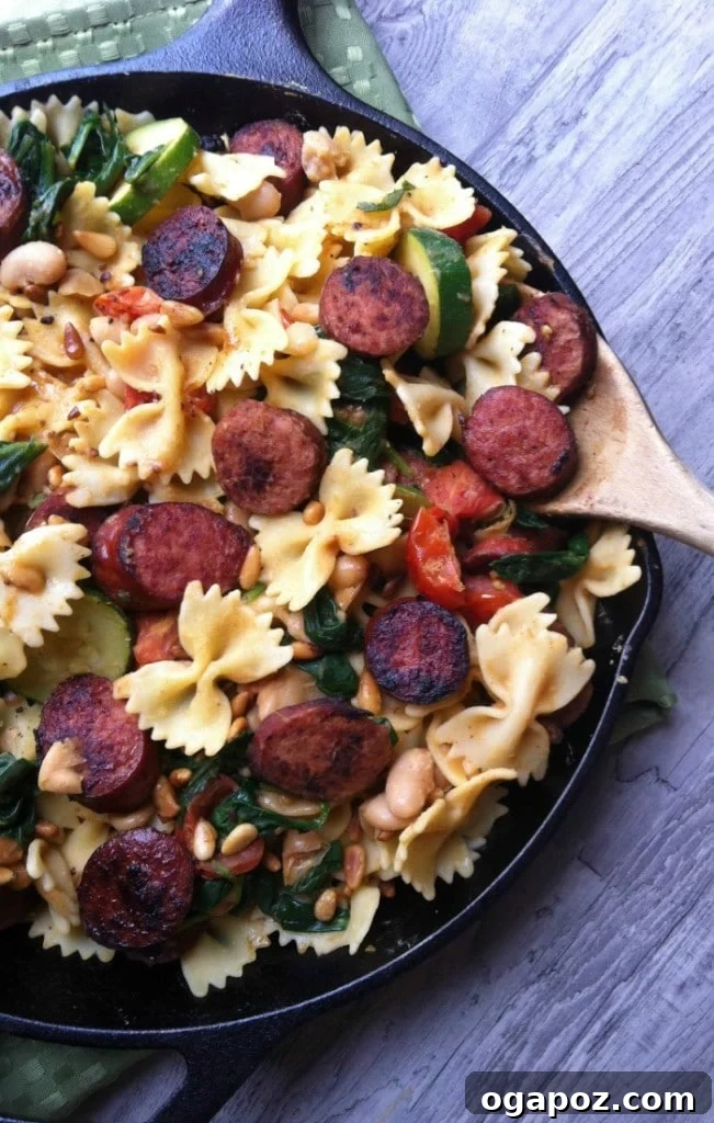 Dinner in 30: 24 Quick and Easy Meals 3 Hearty Smoked Sausage, White Bean and Spinach Pasta with Toasted Pine Nuts, served in a bowl