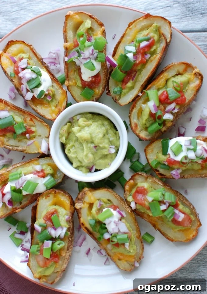 Guacamole Loaded Potato Skins 4 Guacamole Stuffed Potato Skins on white platter