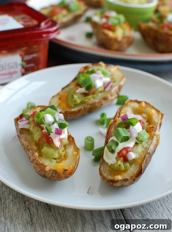 Guacamole Loaded Potato Skins 7 Guacamole Stuffed Potato Skins three on a palte