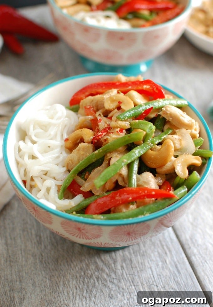 Vibrant Lemongrass Chicken Noodle Bowls 3 Close-up of a stir-fry featuring chicken, red peppers, and green beans for noodle bowls