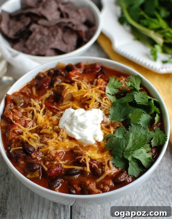Beef and Bean Chili with a dollop of sour cream and fresh herbs