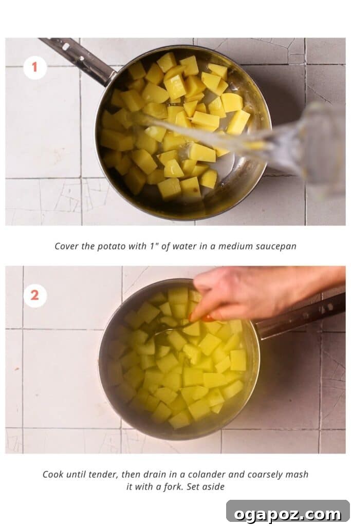 Crispy Potato Masala Curry 4 Potatoes boiling in a saucepan, a crucial step in preparing the aloo masala recipe, ensuring they are tender and ready for mashing.