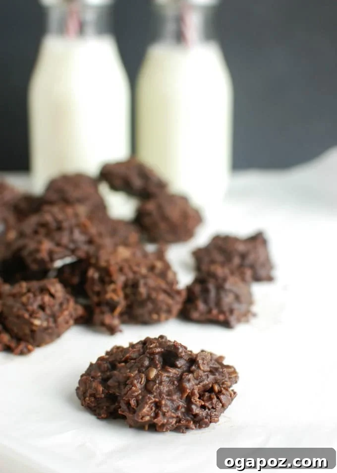 Effortless No-Bake Delights 5 A stack of No Bake Cookies next to a glass of milk, perfect for snacking.