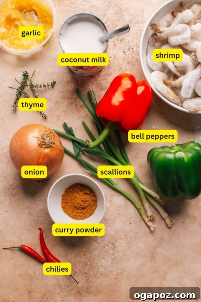 Flavorful Jamaican Curry Shrimp 3 A colorful spread of fresh ingredients including bell peppers, onions, garlic, thyme, and spices, laid out for making Jamaican Curry Shrimp.