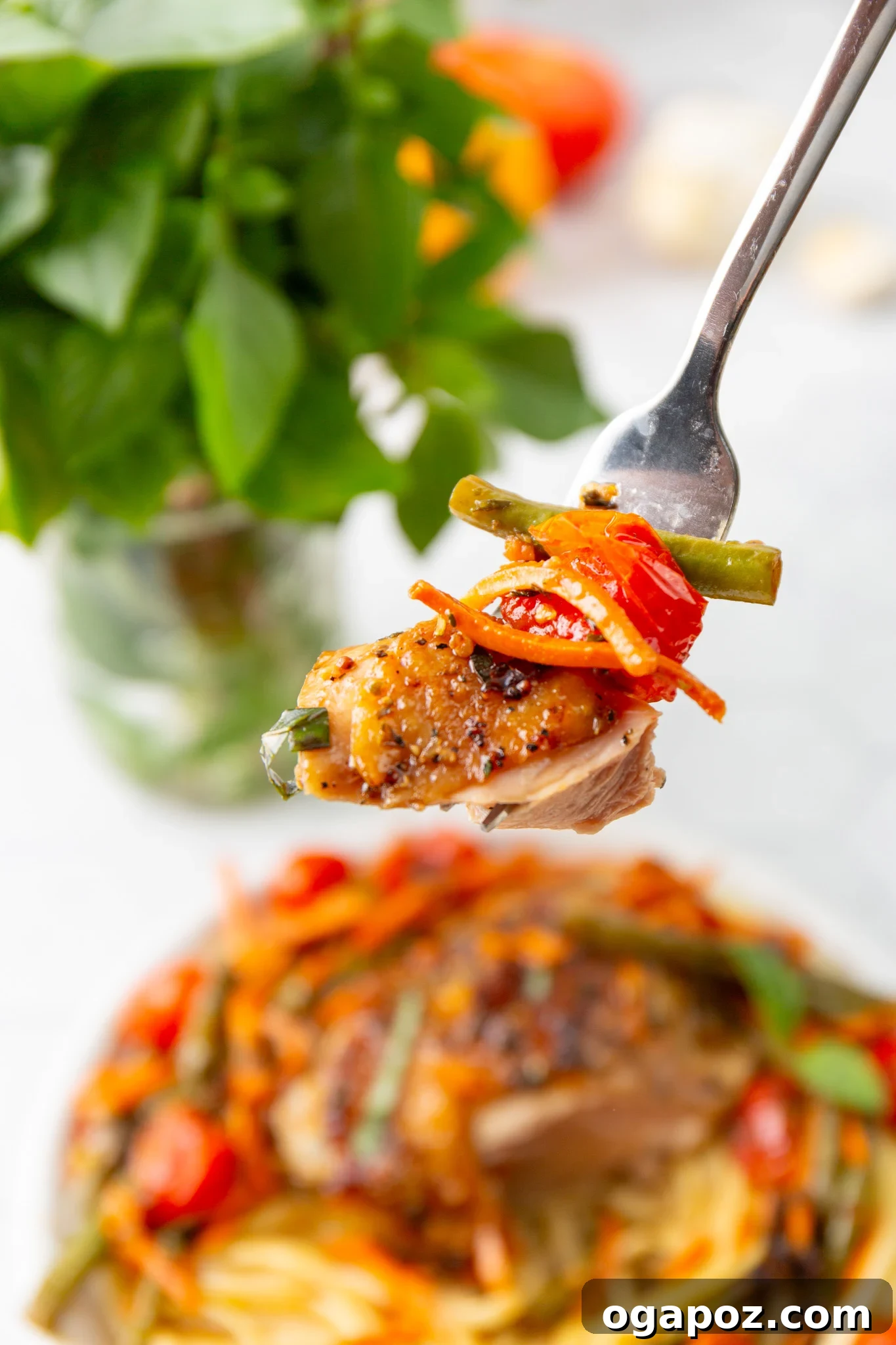 Effortless Balsamic Chicken 11 Easy Balsamic Chicken Recipe served on a fork, highlighting the tender chicken and vegetables