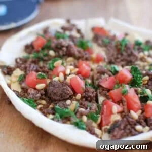 Spiced Beef and Hummus Pita Pizza on a plate, ready to be enjoyed.