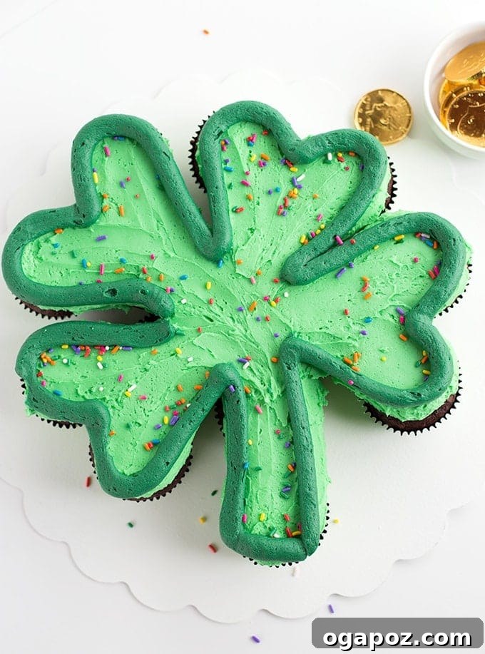Luck of the Irish: Delicious Green Desserts for St Patricks Day 12 A St. Patrick's Day cupcake cake arranged in a four-leaf clover shape, decorated with green frosting and rainbow sprinkles, making for an easy and festive dessert.