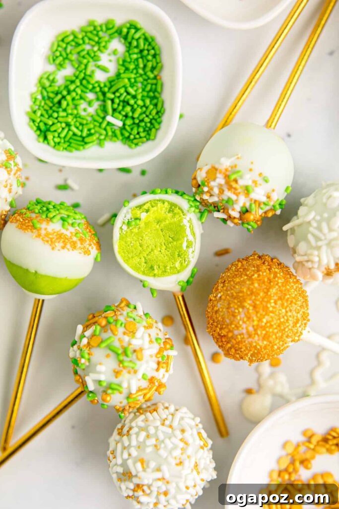 Luck of the Irish: Delicious Green Desserts for St Patricks Day 9 Green cake pops on golden sticks with a cake center, decorated with white chocolate and green sprinkles, showcasing a fun St. Patrick's Day dessert.