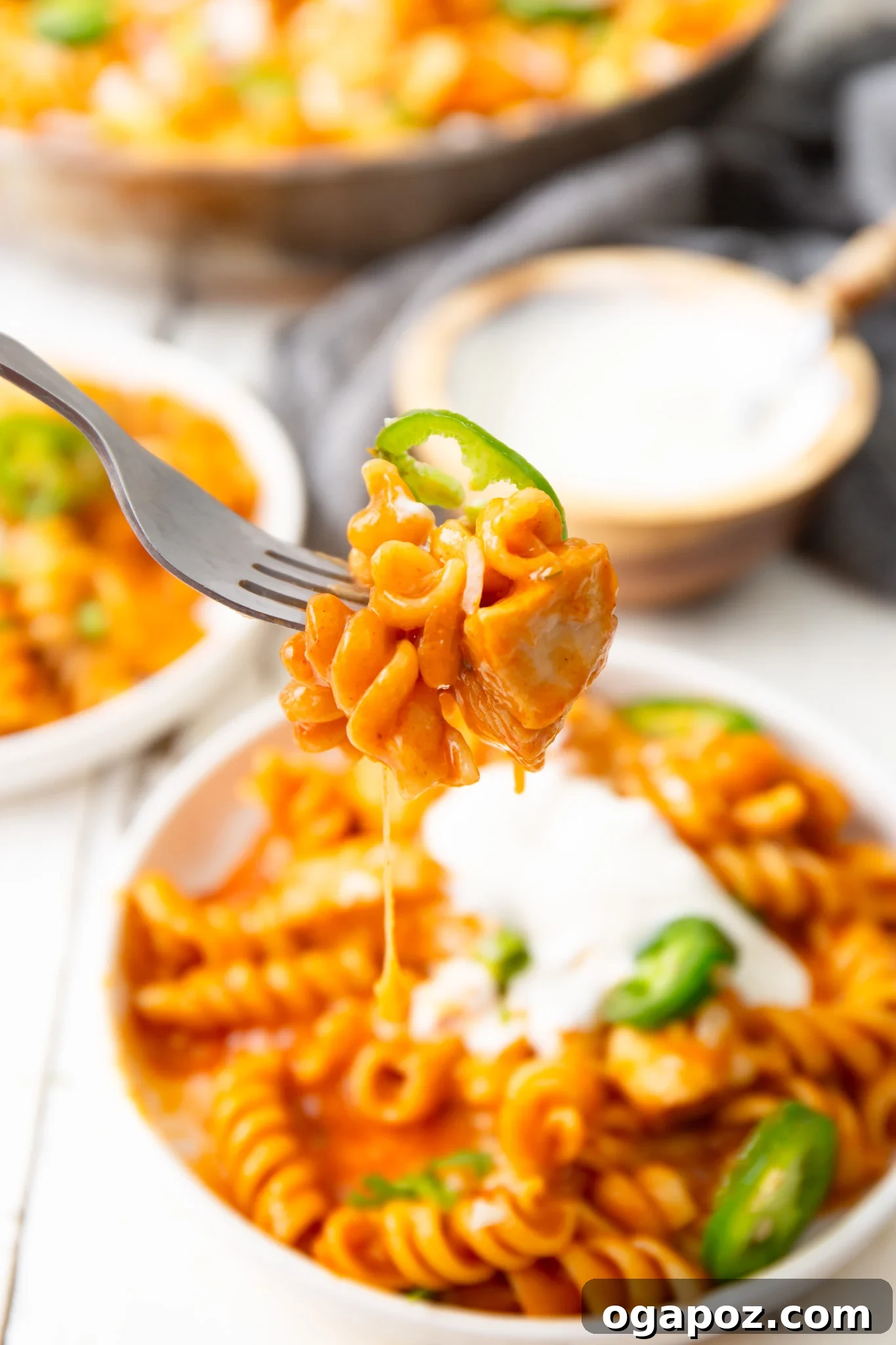 One-Pan Enchilada Chicken Pasta 4 One Pot Chicken Enchilada Pasta on a fork