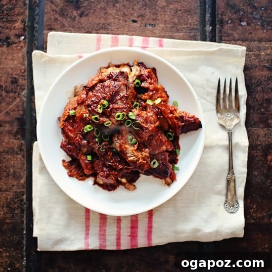 Sweet and Smoky Cranberry Chipotle Ribs 2 Plated cranberry chipotle BBQ ribs with sauce