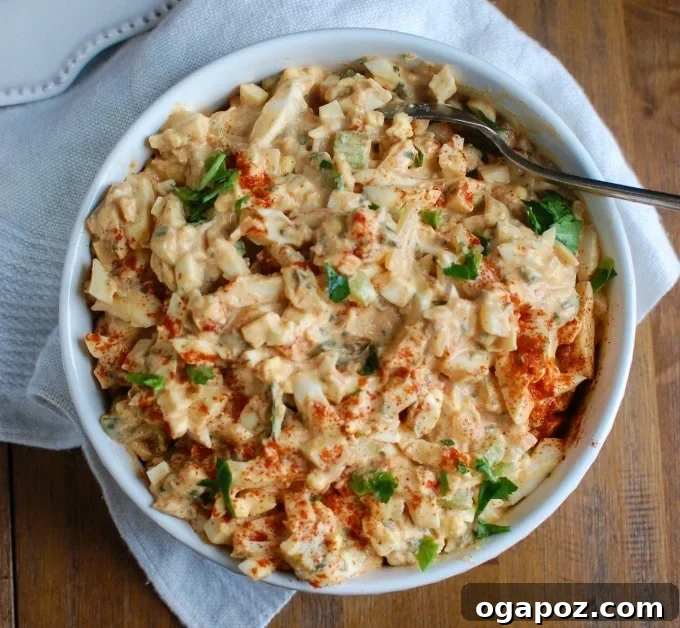 Homestyle Sweet Southern Egg Salad 5 A large ceramic bowl filled with Sweet Southern-Style Egg Salad, ready for family-style serving.