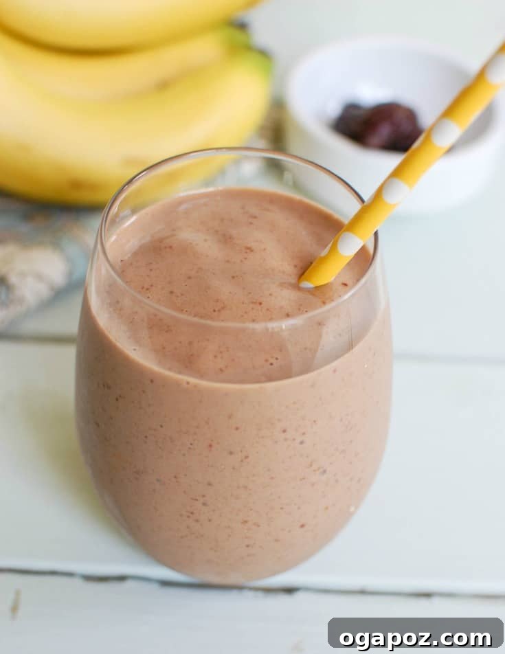 Golden Banana Date Delight 2 Creamy Banana Date Smoothie in a glass, looking rich and inviting. A perfect healthy breakfast or snack.