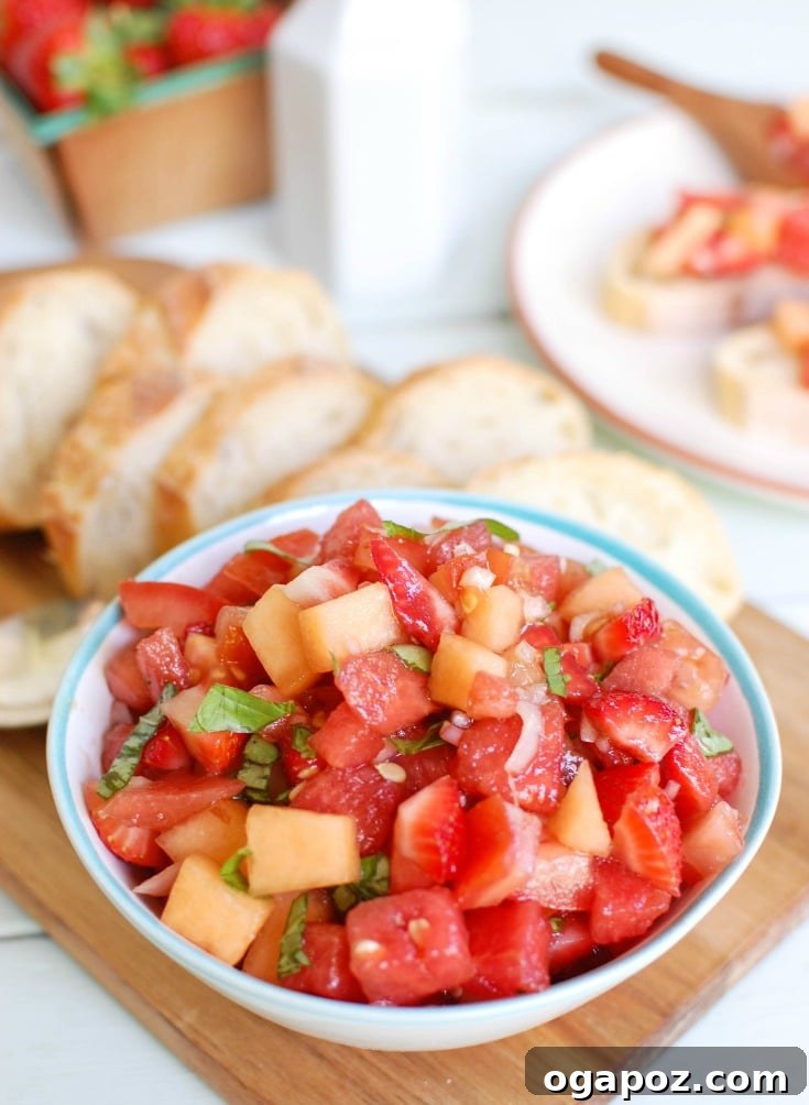 Sun-Kissed Berry Melon Bruschetta 2 Vibrant Berry Melon Bruschetta served on golden toasted baguette slices, garnished with fresh basil. A perfect, colorful appetizer for summer gatherings.