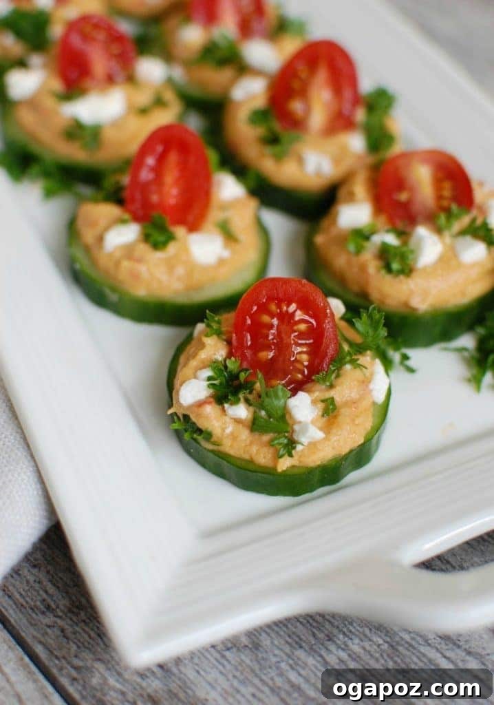 Refreshing Cucumber Hummus Snacks 4 Cucumber Hummus Bites on white platter