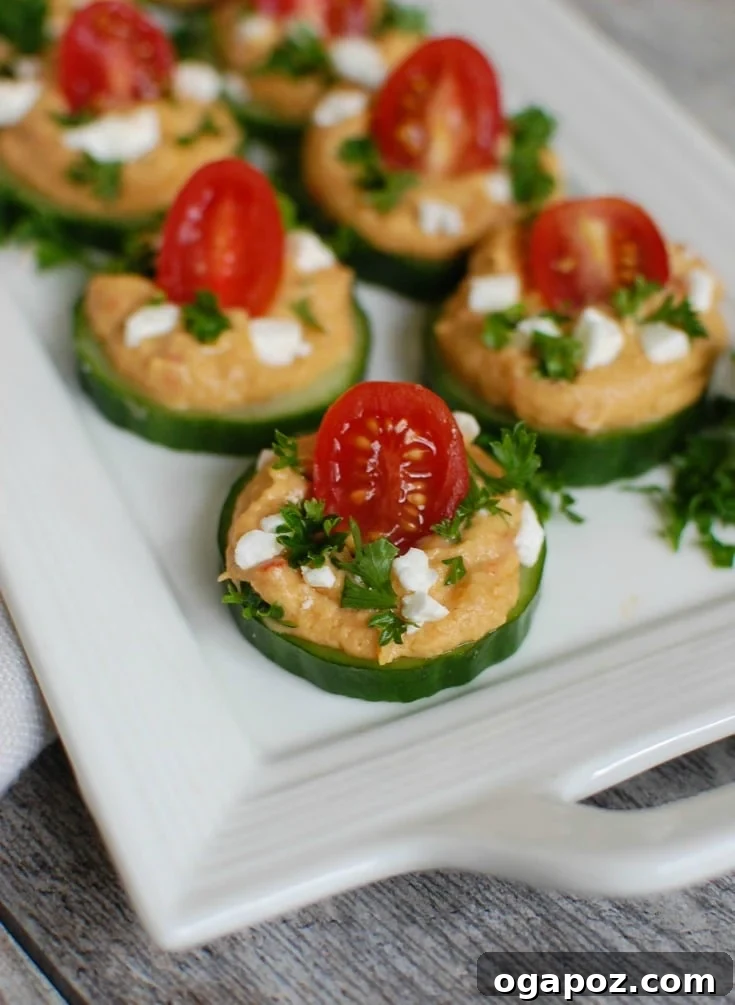 Refreshing Cucumber Hummus Snacks 5 Cucumber Hummus Bites on white plate