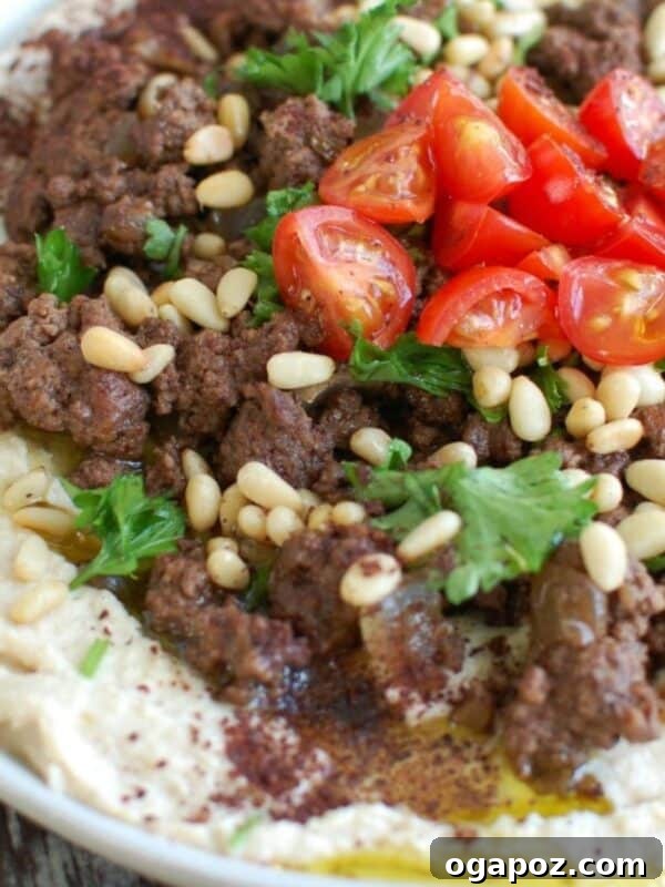 Refreshing Cucumber Hummus Snacks 8 Hummus with Spiced Beef and Toasted Pine Nuts on white plate