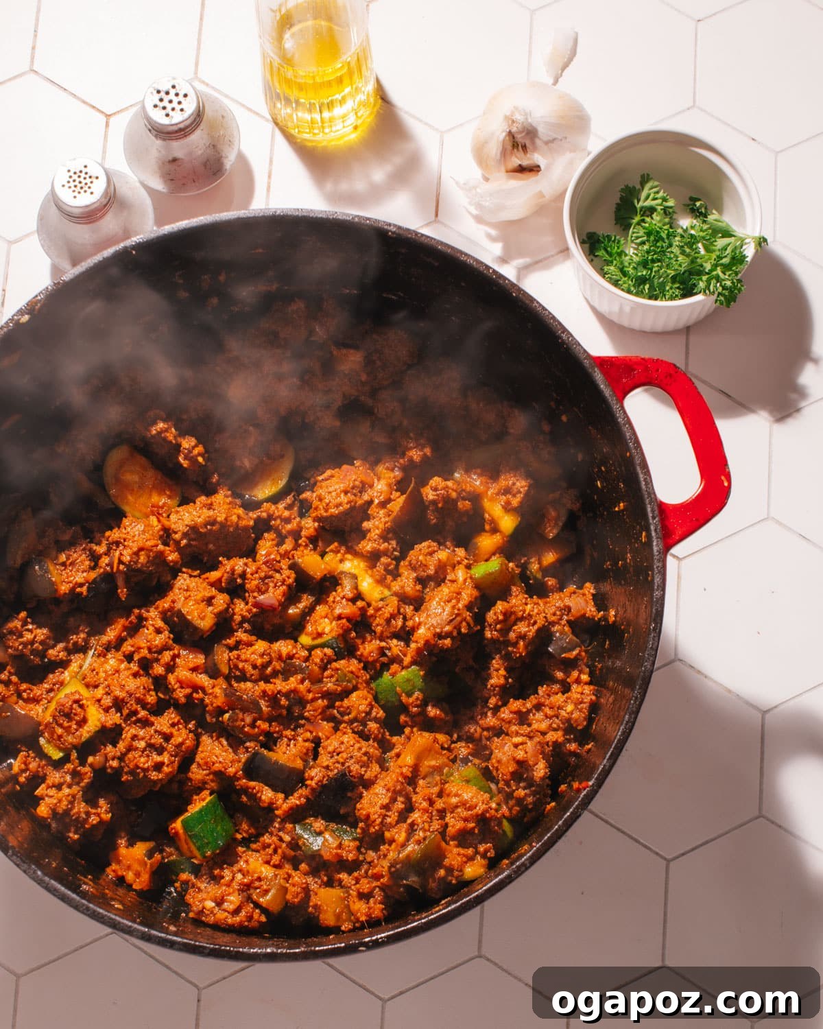 Greek Lamb and Potato Pie 5 Rich Greek Moussaka Meat Sauce simmering in a Dutch oven.