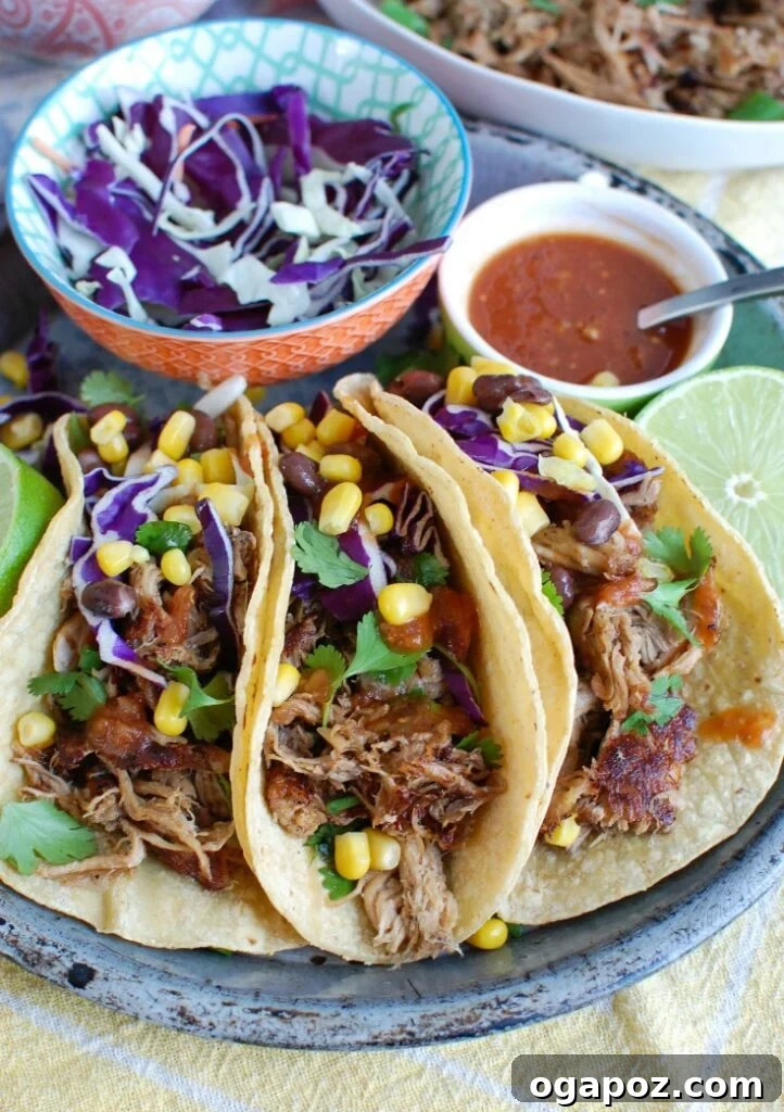 Effortless Slow Cooker Pork Carnitas 5 Three beautifully prepared Slow Cooker Pork Carnitas tacos, filled with rich shredded pork and fresh toppings