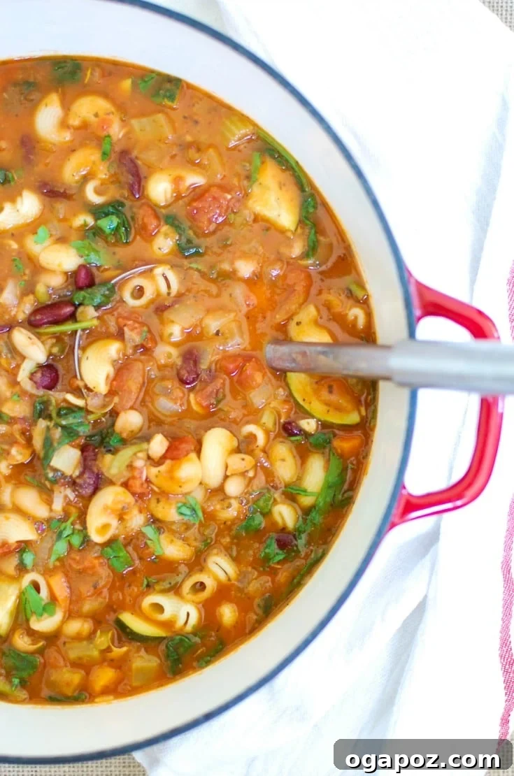 Heartwarming Homemade Minestrone 2 Homemade Minestrone Soup in Pot, showcasing vibrant vegetables and a rich tomato base, ready to be served.