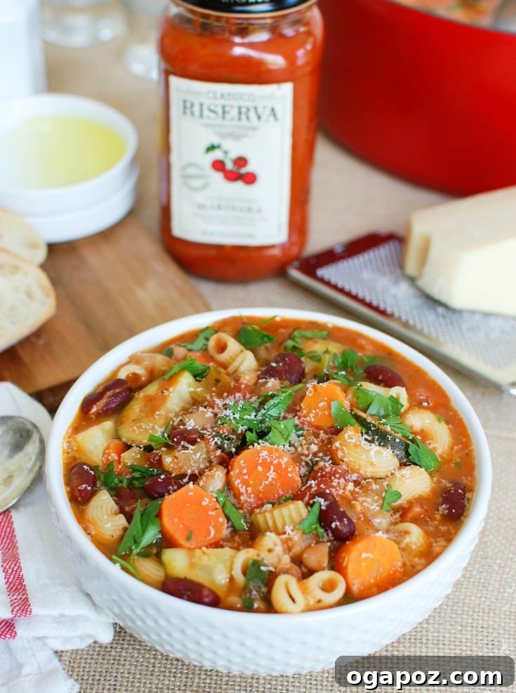 Heartwarming Homemade Minestrone 3 Homemade Minestrone Soup Recipe with a generous topping of freshly grated cheese, ready to be enjoyed.