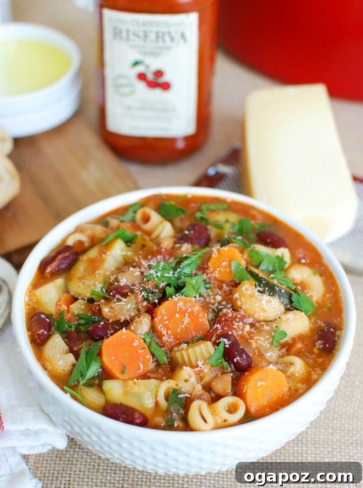 Heartwarming Homemade Minestrone 4 Homemade minestrone soup ingredients, including a jar of rich marinara sauce, fresh vegetables, and beans.