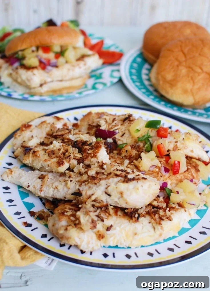 Crispy Macadamia Coconut Crusted Chicken with a side of fresh Pineapple Salsa, a perfect tropical summer meal.