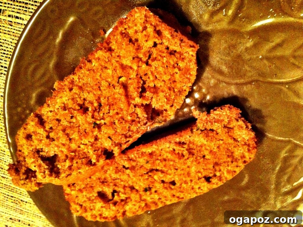 Slices of warm Pumpkin Zucchini Bread arranged on a plate