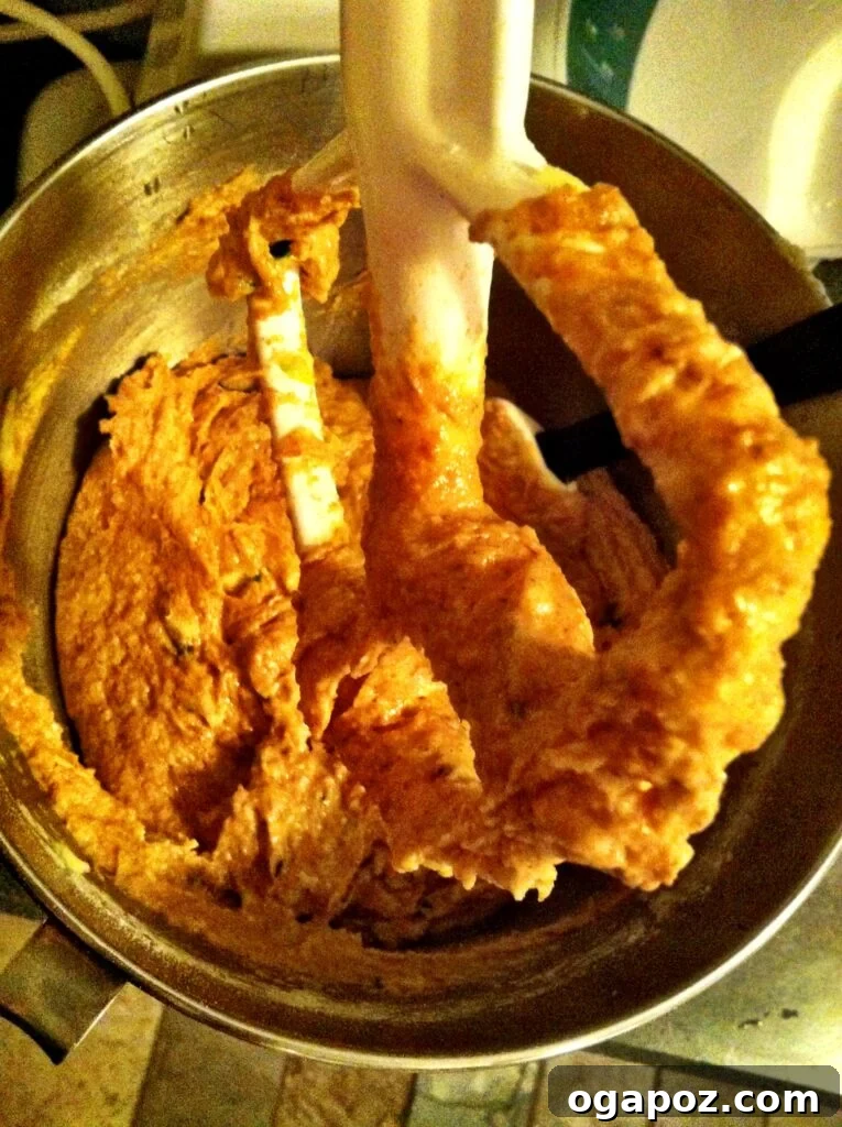 Mixing the batter for Pumpkin Zucchini Bread in a large bowl