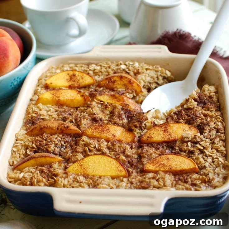 Golden Peach and Cream Oven Oats 4 A delectable slice of Peaches and Cream Baked Oatmeal, garnished with fresh peach slices and a drizzle of cream, perfectly portioned for a healthy and satisfying breakfast or brunch.
