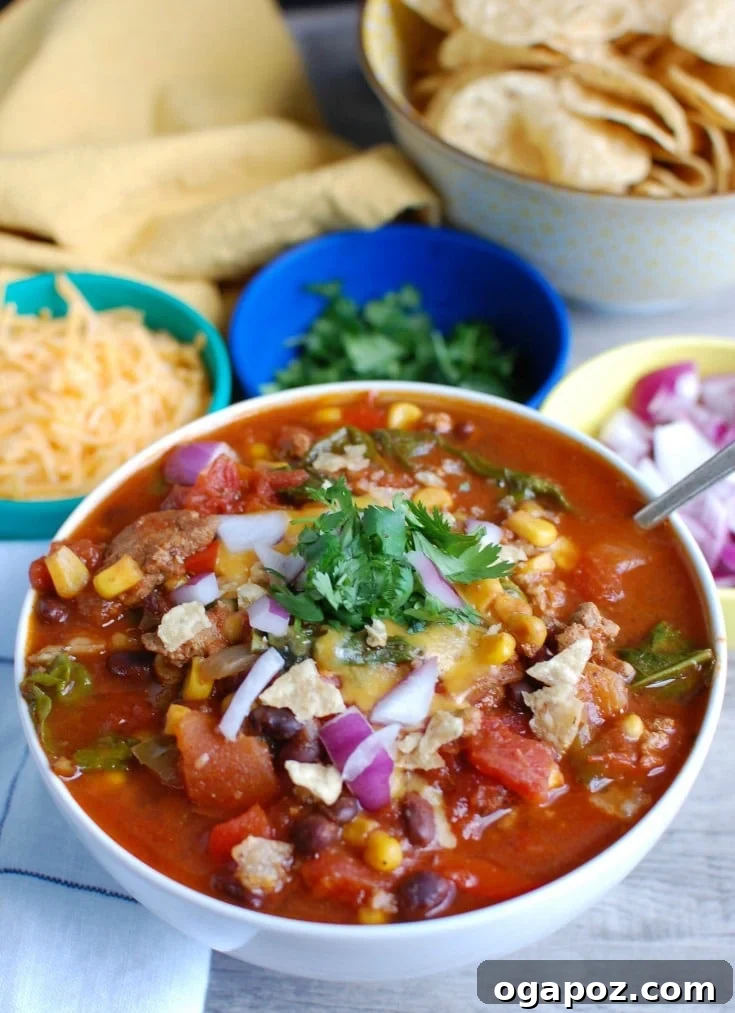 Wholesome Slow-Cooked Turkey and Kale Chili 3 Hearty slow cooker turkey kale chili served in a bowl with fresh toppings.