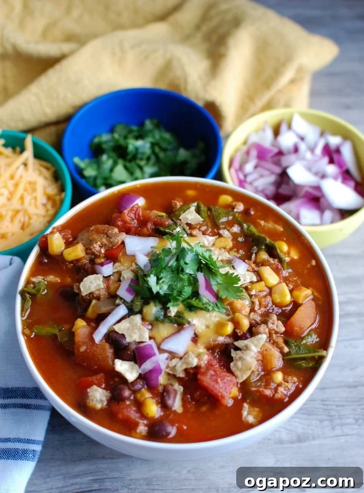 Wholesome Slow-Cooked Turkey and Kale Chili 5 Hearty and healthy Slow Cooker Turkey Kale Chili ready to be served with delicious toppings.