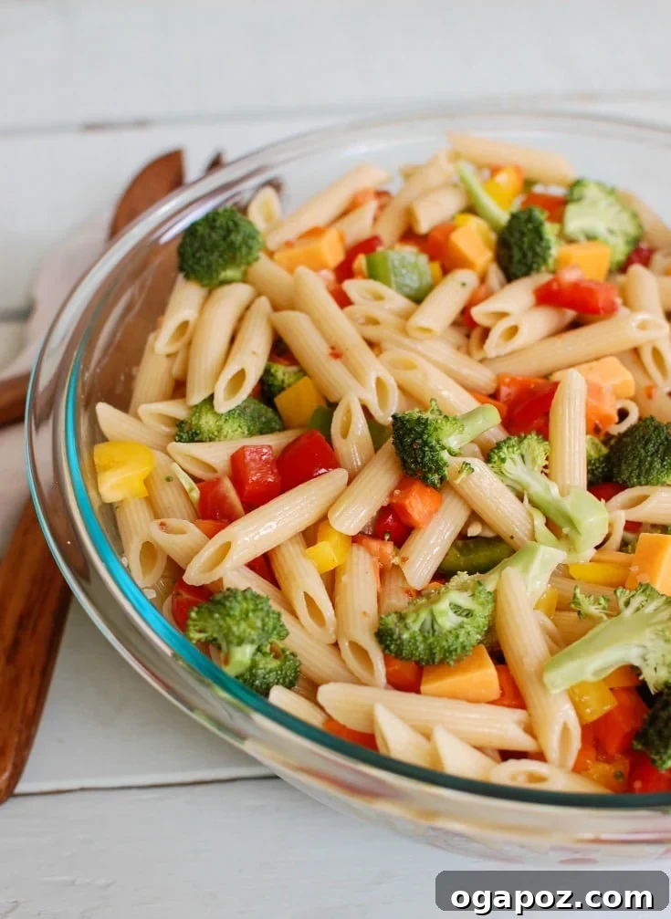 The Ultimate Pasta Salad 2 Vibrant Classic Pasta Salad overflowing with fresh vegetables and rich flavors, ideal for any summer gathering or BBQ.