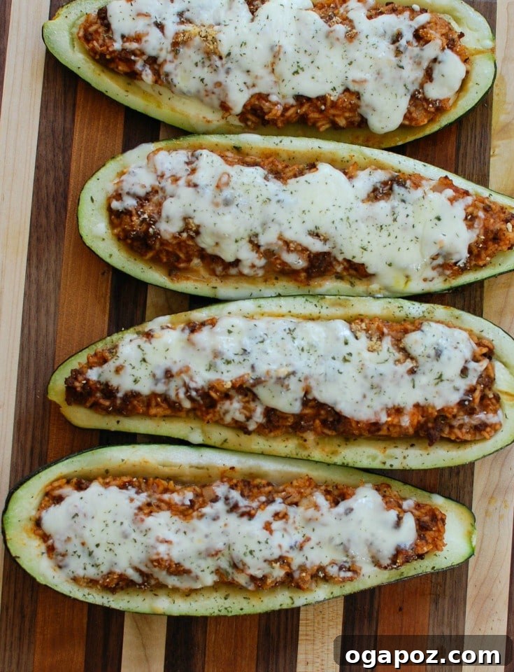 Mediterranean Zucchini Jewels 3 Two Mediterranean Zucchini Boats filled with ground beef, lamb, rice, and spices, before being topped with cheese.
