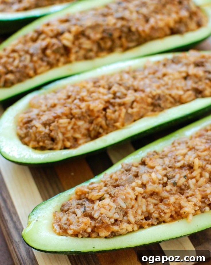 Mediterranean Zucchini Jewels 5 Finished Mediterranean Zucchini Boats, garnished with fresh parsley and Parmesan cheese.