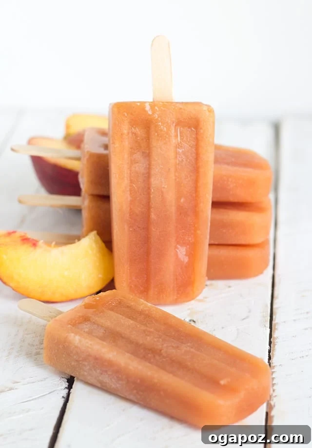 25 Ice Pop Sensations to Conquer Summer Heat 8 Sweet Boozy Sweet Peach Tea Popsicles, an adult-friendly frozen cocktail perfect for summer gatherings.