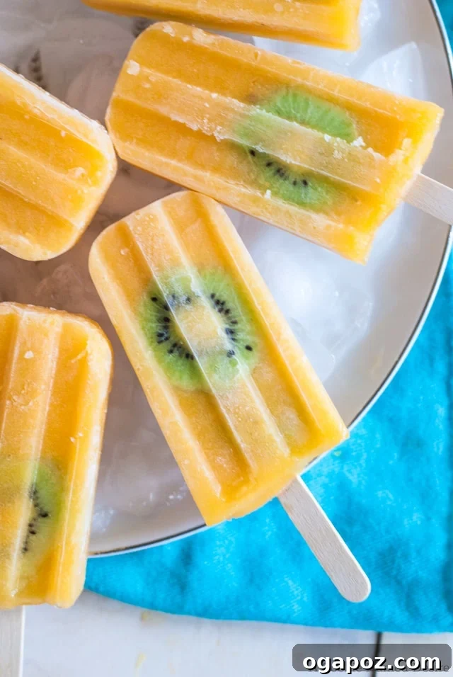 25 Ice Pop Sensations to Conquer Summer Heat 9 Bright Mango Kiwi Lemonade Popsicles, a tangy and sweet fruit popsicle for hot days.