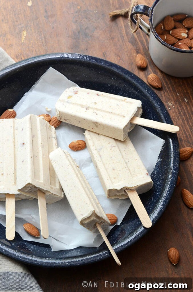 25 Ice Pop Sensations to Conquer Summer Heat 16 Rich Cinnamon and Toasted Almond Dulce de Leche Cheesecake Popsicles, a gourmet frozen dessert.