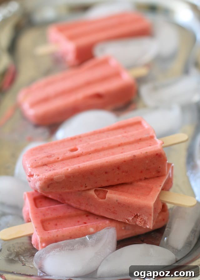 25 Ice Pop Sensations to Conquer Summer Heat 11 Homemade Strawberry Coconut Milk Popsicles, a dairy-free and creamy fruit treat.