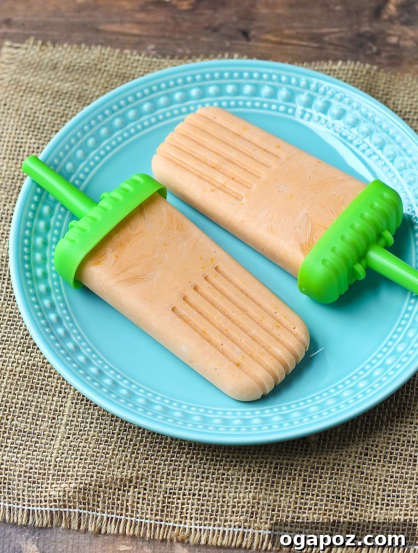 25 Ice Pop Sensations to Conquer Summer Heat 19 Healthy Orange Creamsicle Popsicle, a refreshing and nostalgic frozen dessert.