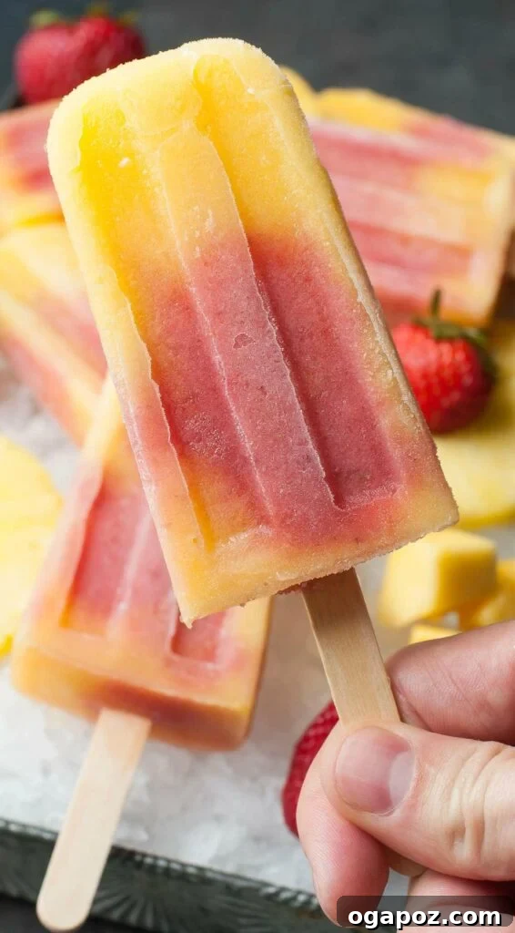 25 Ice Pop Sensations to Conquer Summer Heat 4 Vibrant Tropical Mango Pineapple Strawberry Swirled Fruit Pops, a healthy and kid-friendly frozen treat.