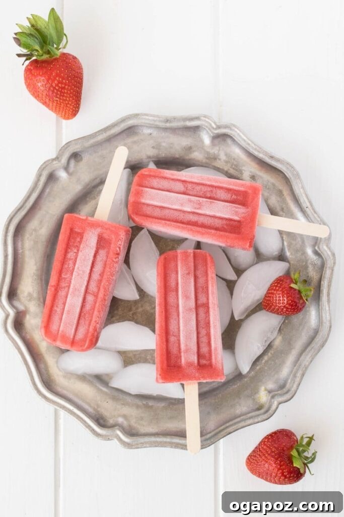 25 Ice Pop Sensations to Conquer Summer Heat 5 Fresh homemade Strawberry Popsicles, simple and sweet, ideal for a classic summer fruit treat.