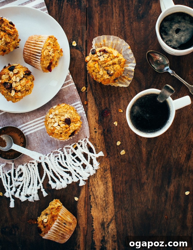 Wholesome One-Bowl Carrot-Spice Oatmeal Muffins 2 A freshly baked carrot oatmeal muffin, showcasing its golden-brown top and wholesome ingredients.